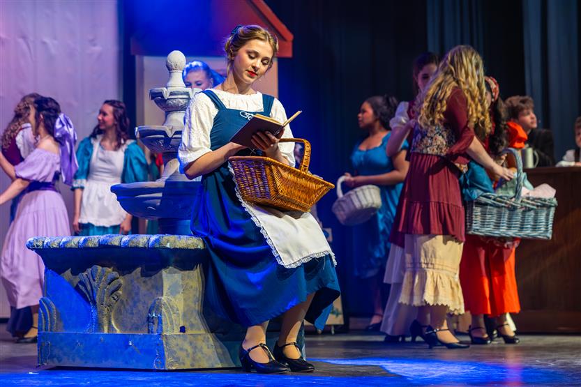 Actors perform onstage